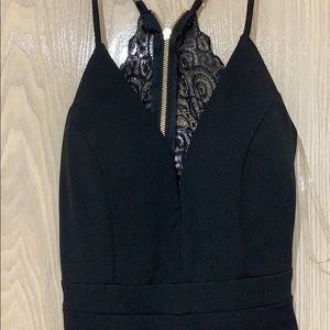 Never worn open back black romper